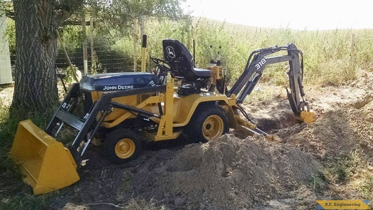 John Deere 318 Micro Hoe digging 2 by Jake T.