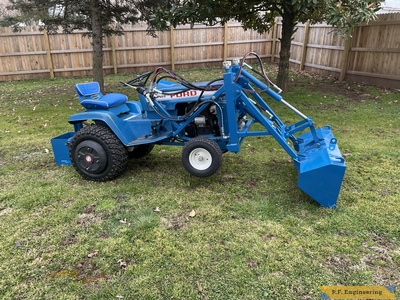 Patrick C. Ford LGT 145 pin-on mini payloader lifting front end